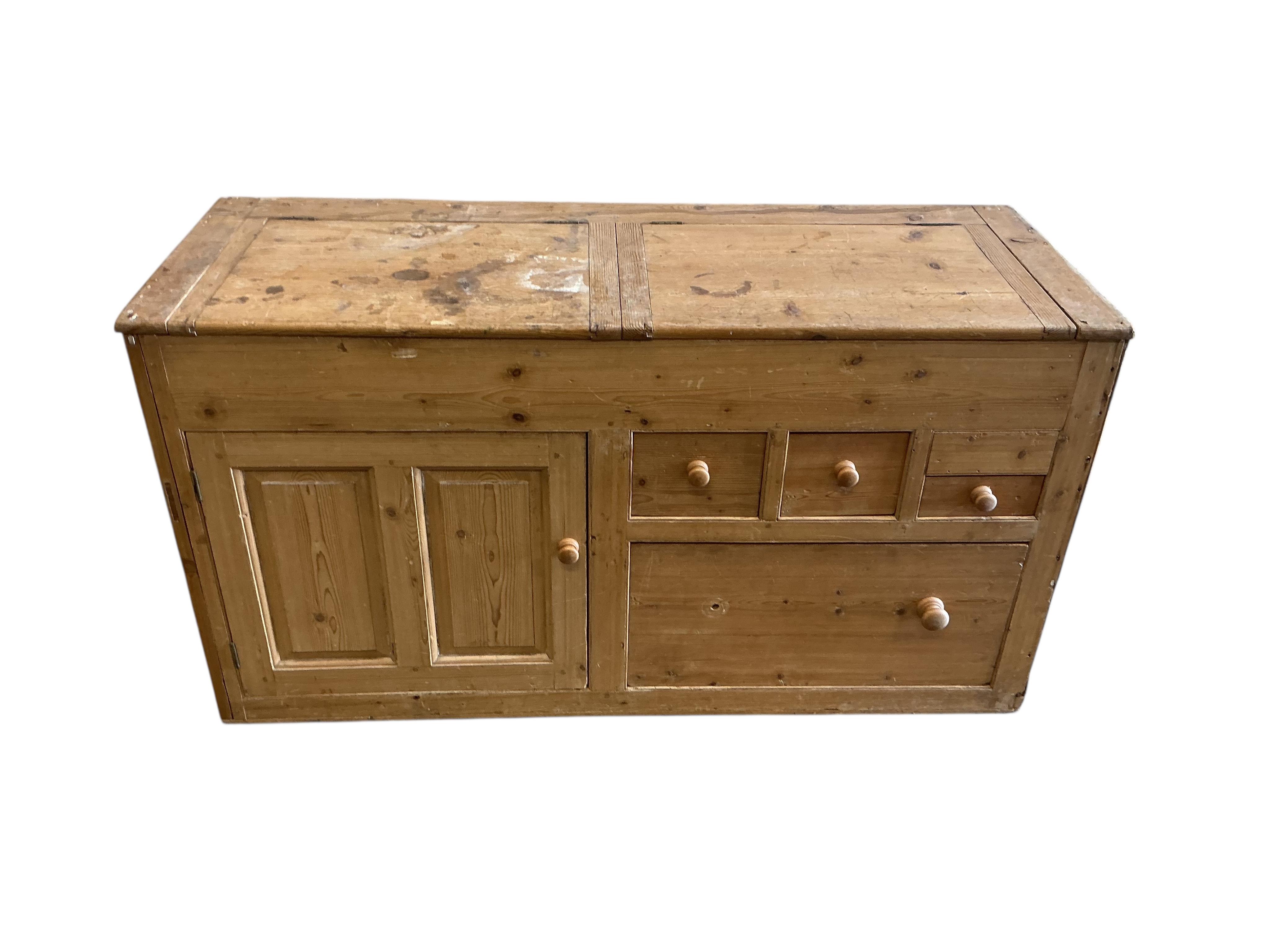 A Victorian pine low dresser with twin hinged compartment top, width 150cm, depth 53cm, height 80cm